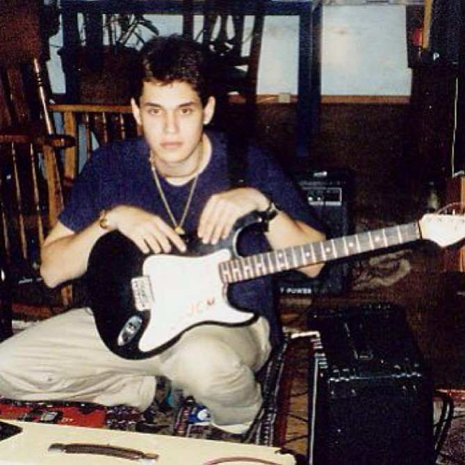John Mayer holding a 1990s Squier Stratocaster